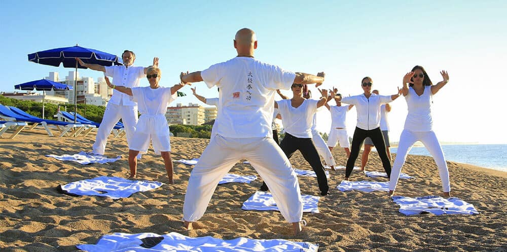 group of people do taichi exercise group of people do taichi exercise